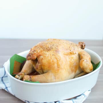whole chicken in a casserole dish