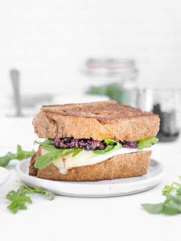 turkey and brie sandwich with blueberry mustard and arugula in it