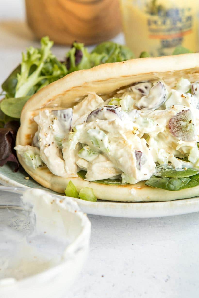 Close up of chicken Salad Pita Sandwich on a blue plate