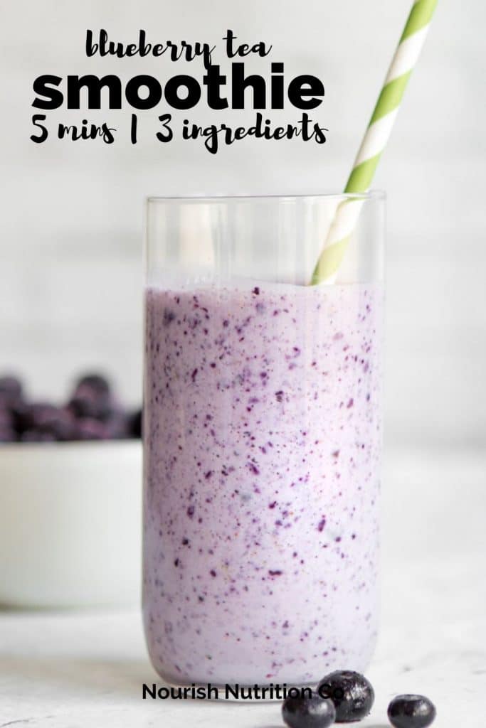 wild blueberry smoothie in a glass with green straw and a text overlay