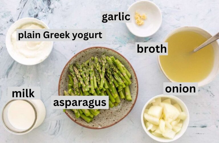 ingredients for creamy asparagus soup on a table