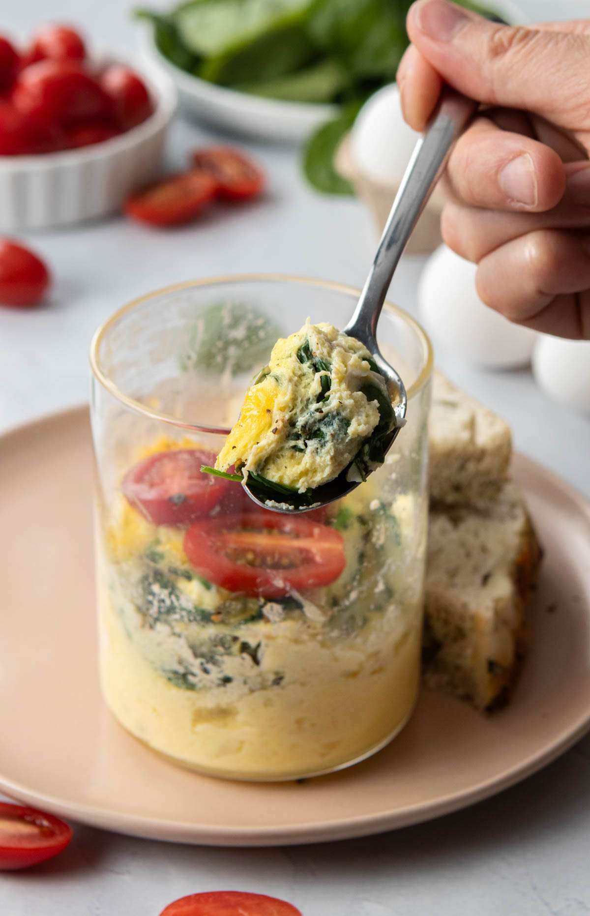 microwave egg bowl on a table with a fork