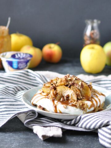 apple tart with apples on top and apples and yogurt in the background