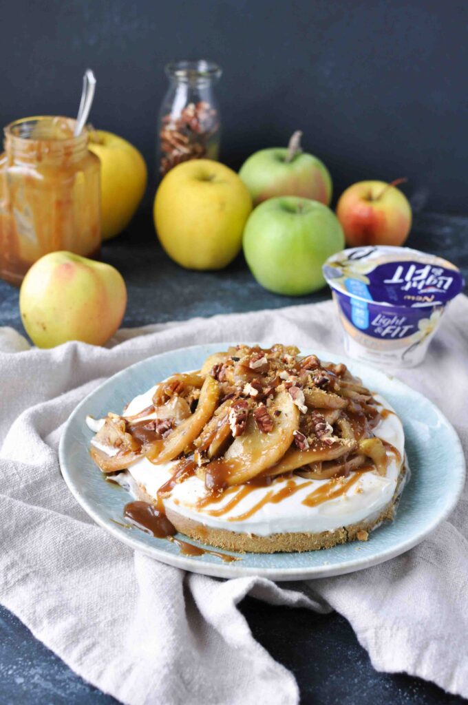 apple tart with apples on top and apples and yogurt in the background