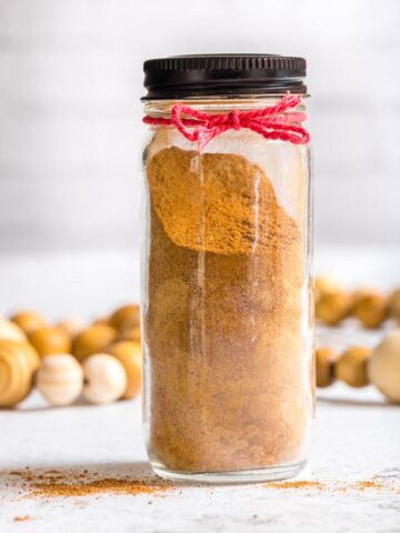 gingerbread spice in teaspoon with spice in jar in background