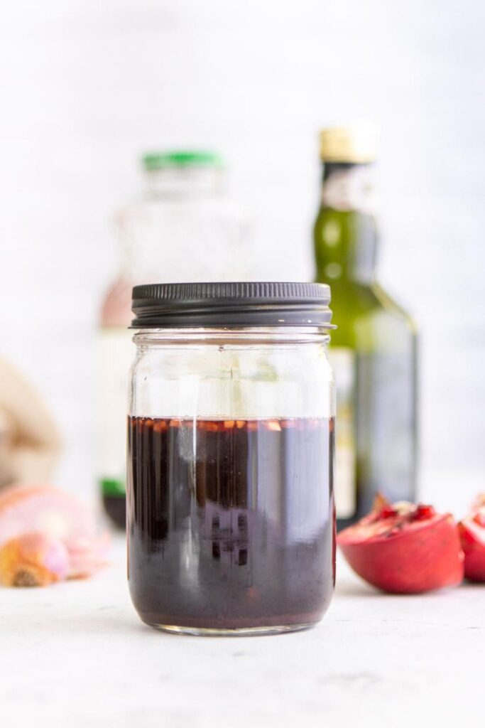 Pomegranate Balsamic Vinegar in a mason jar with ingredients in the background