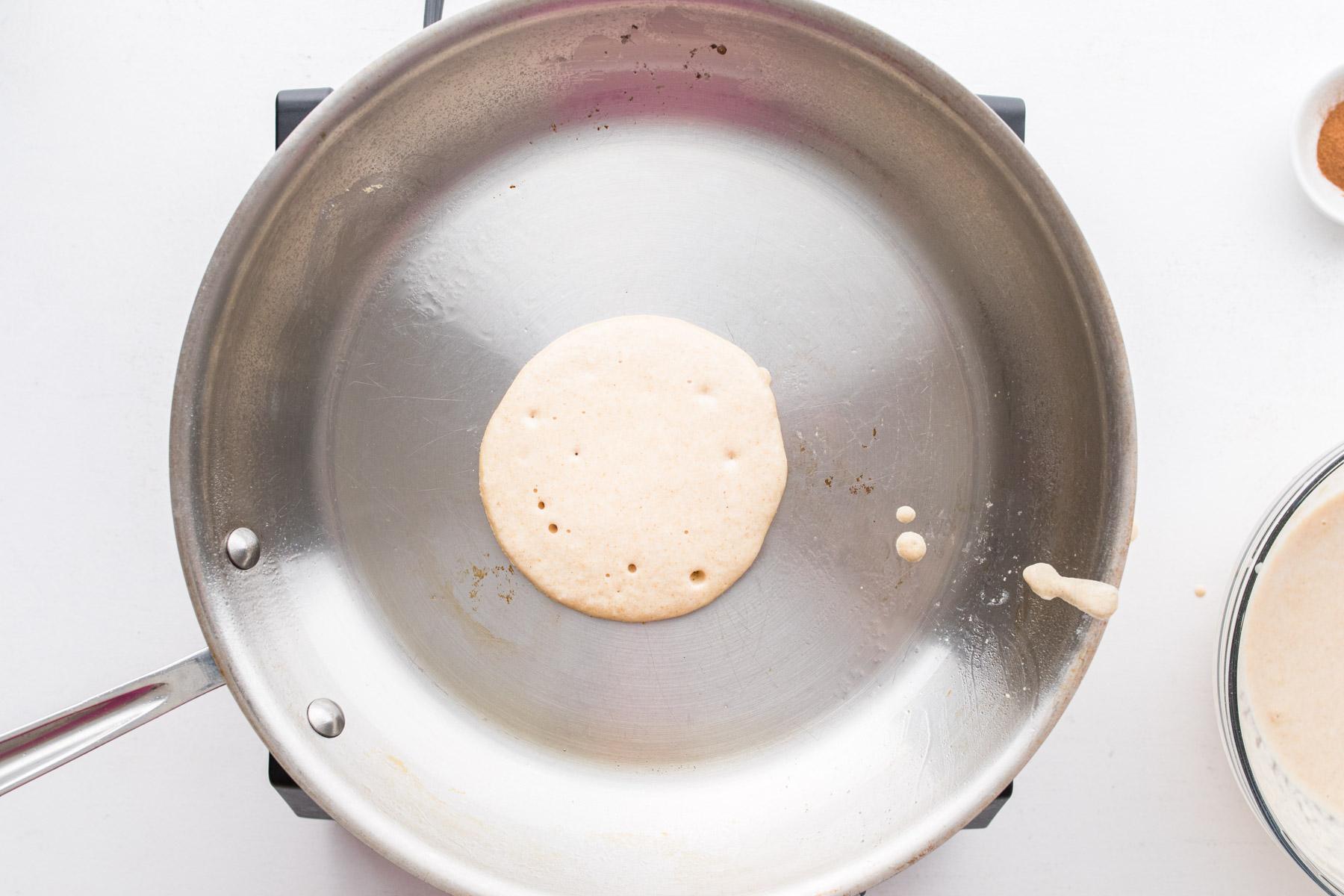 pancake cooking in a large pan