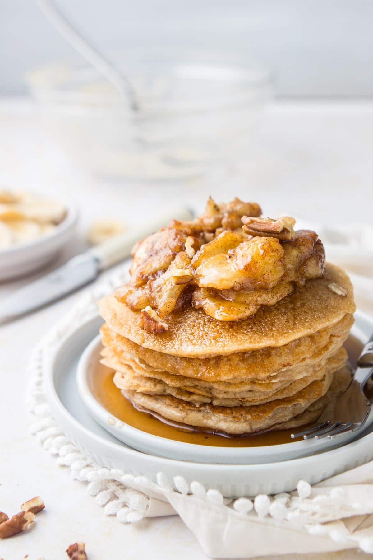 stack of bananas foster pancakes on plate