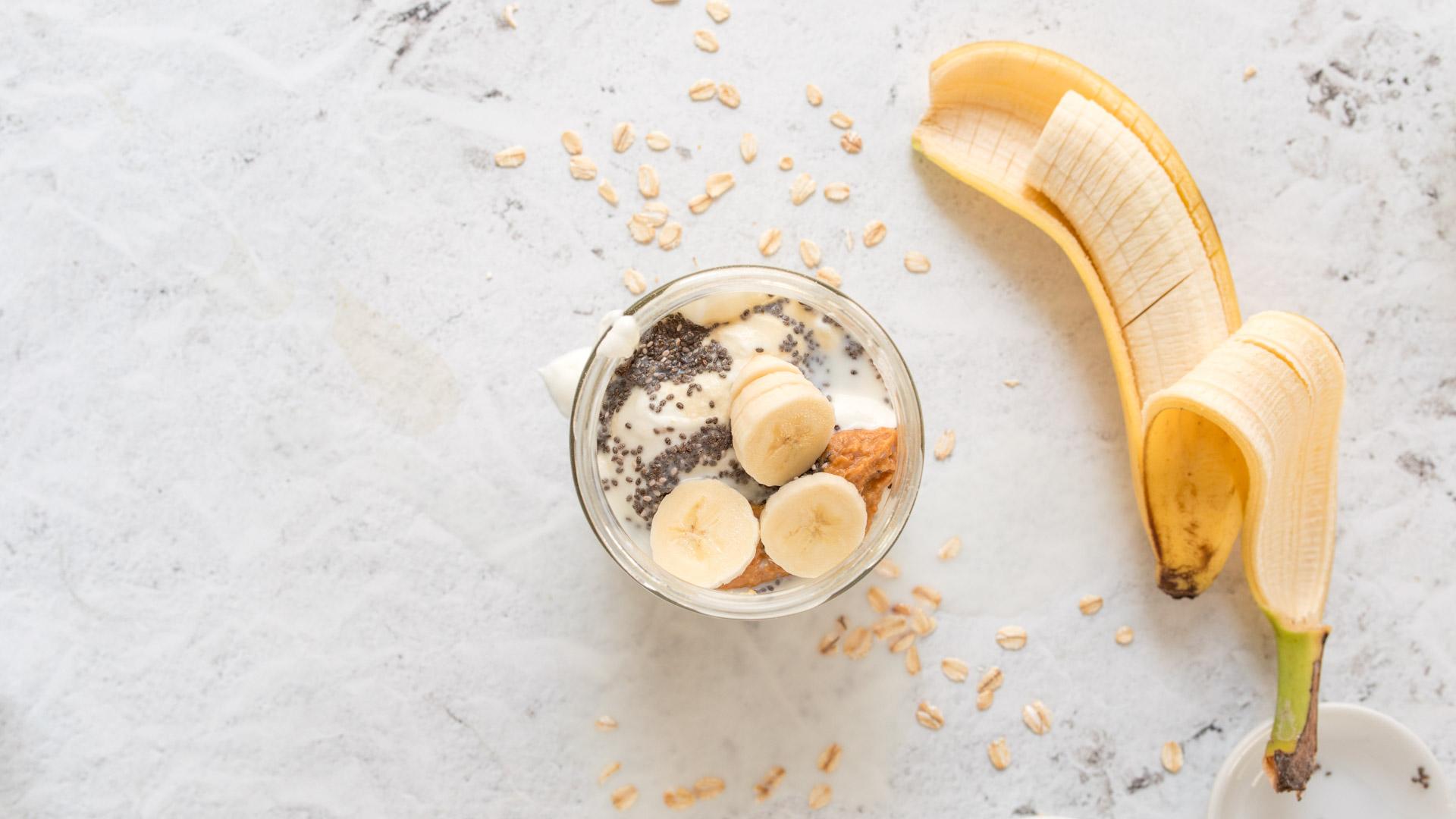 step 1 of building overnight oats: add Greek yogurt and oats to a mason jar