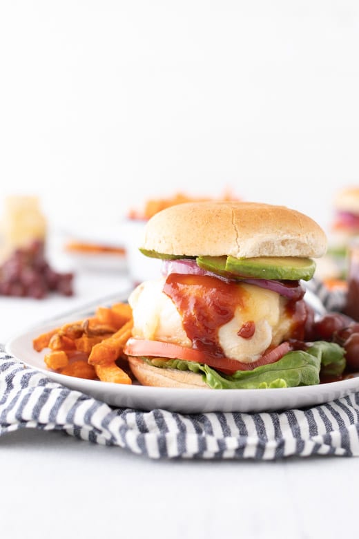 side shot of assembled grilled chicken burger