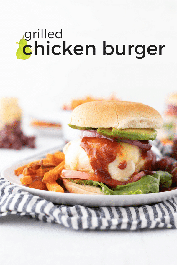 side shot of assembled grilled chicken burger with text overlay