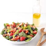 summer berry salad with homemade dressing on side
