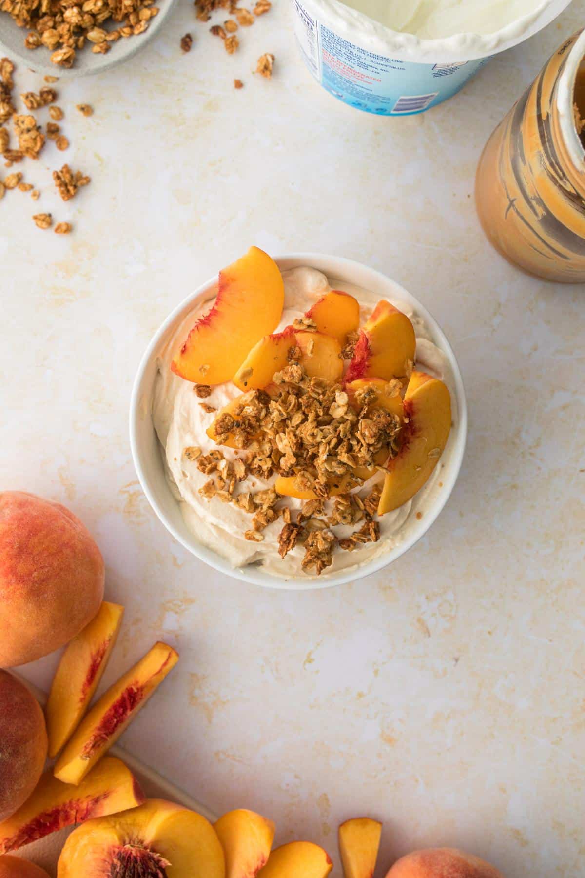 PB Greek yogurt dip with Dannon Light & Fit yogurt cup, apples, and graham crackers on table