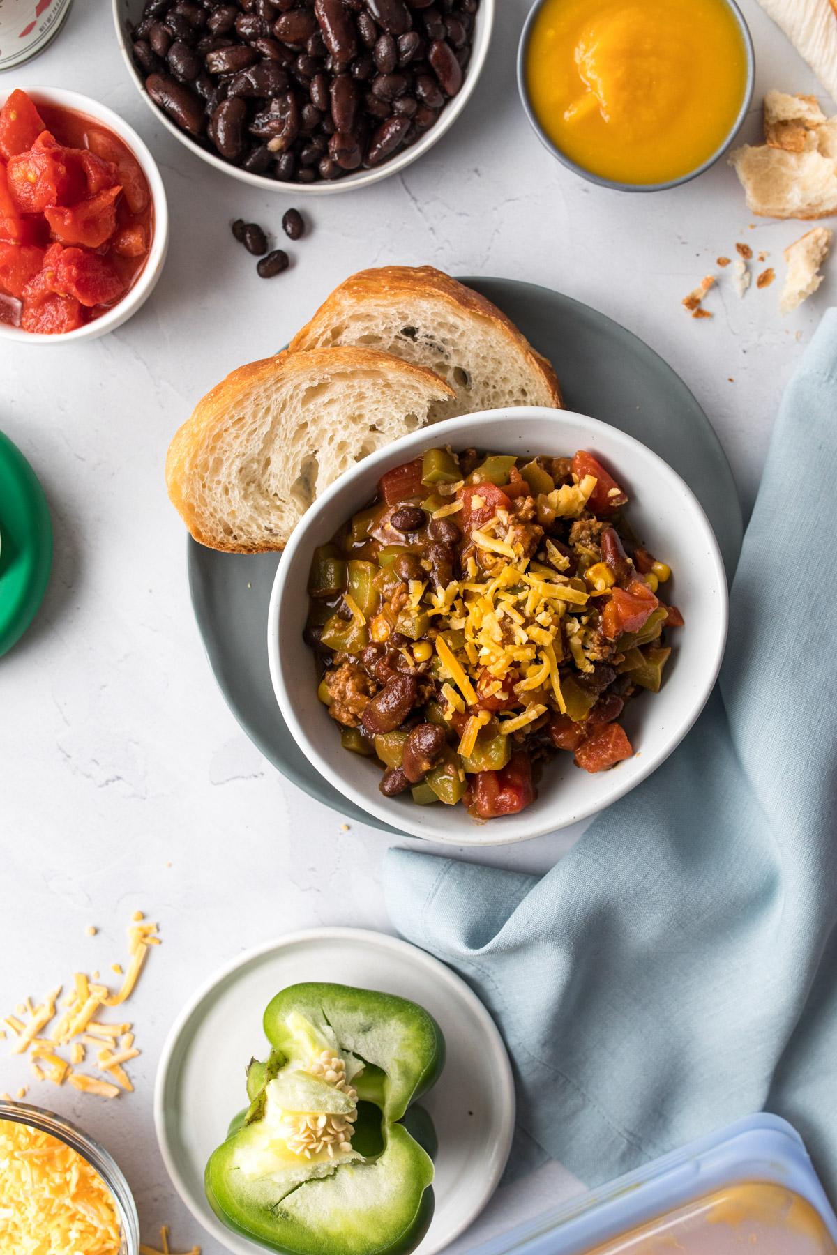 30 minute pumpkin chili with ground turkey on table with bread