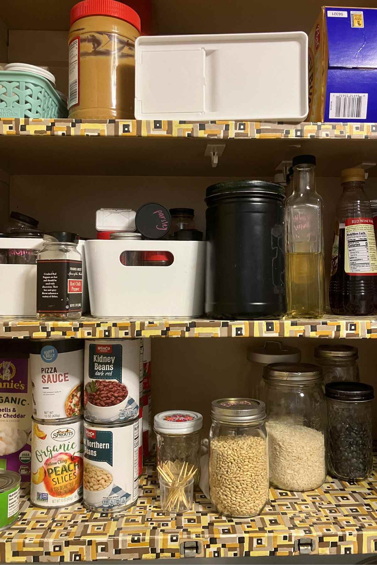 three shelves with pantry staples for one