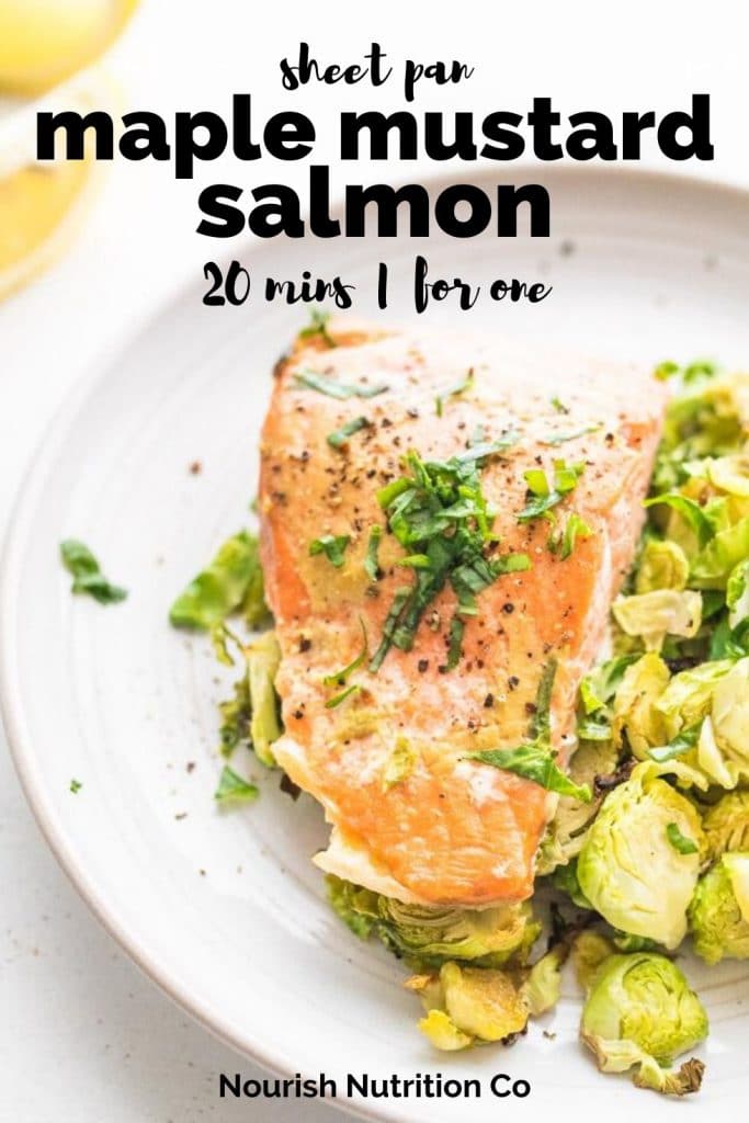 maple mustard salmon and brussels sprouts with a lemon wedge on a plate with text overlay