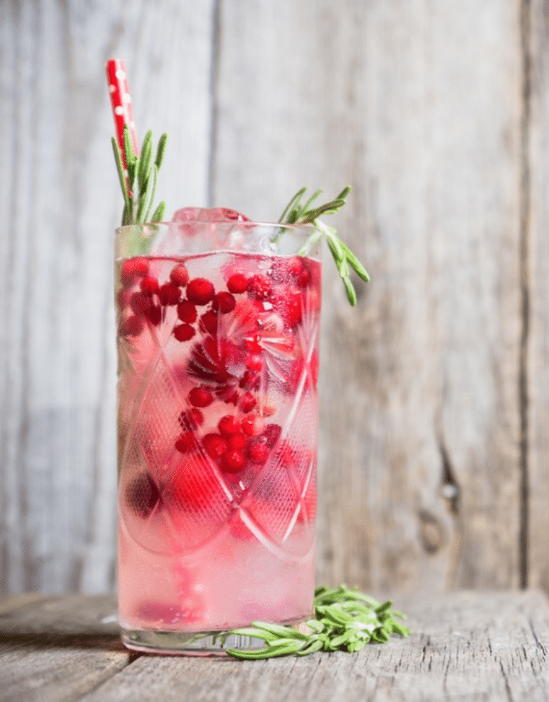 drink with cranberries and rosemary in it