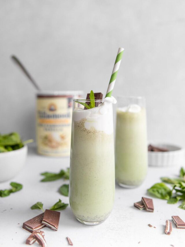 homemade shamrock shake with green straw and ingredients in the background