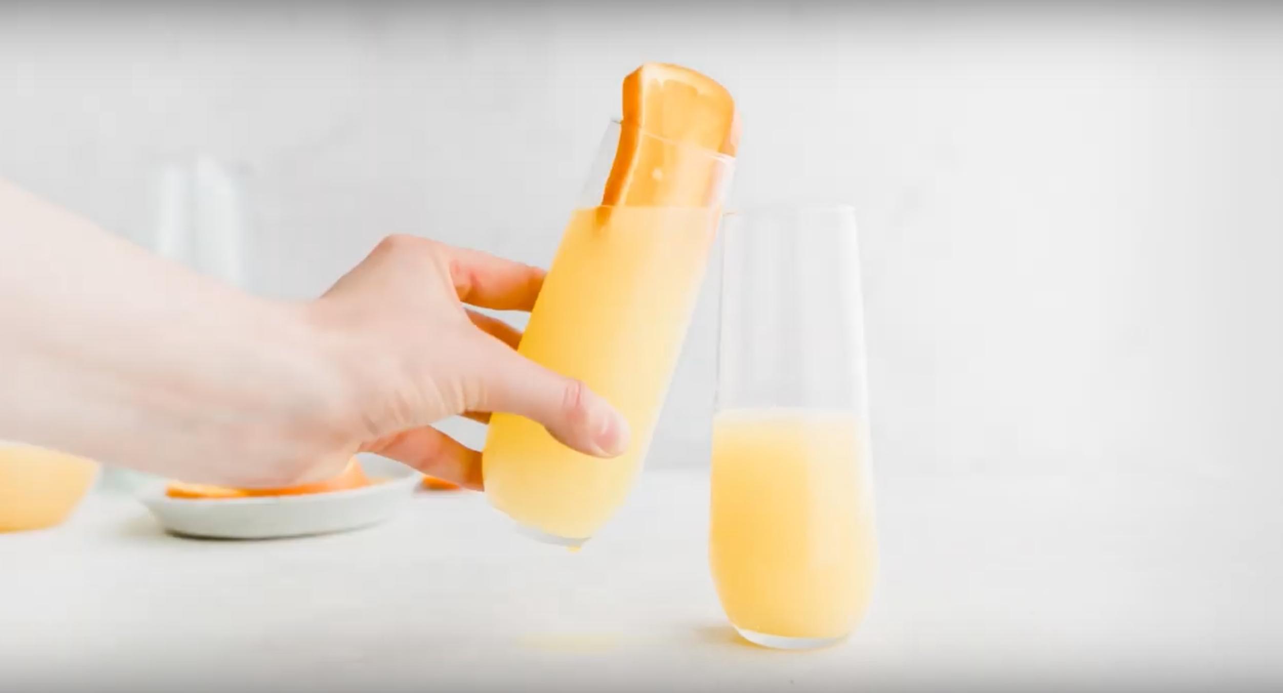 clinking mimosa mocktail champagne glasses
