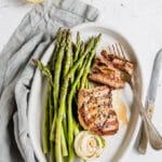 lamb steak with asparagus on a plate