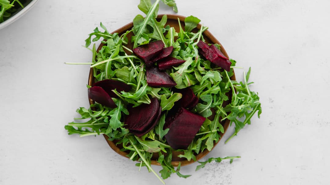 beets and arugula on a plate