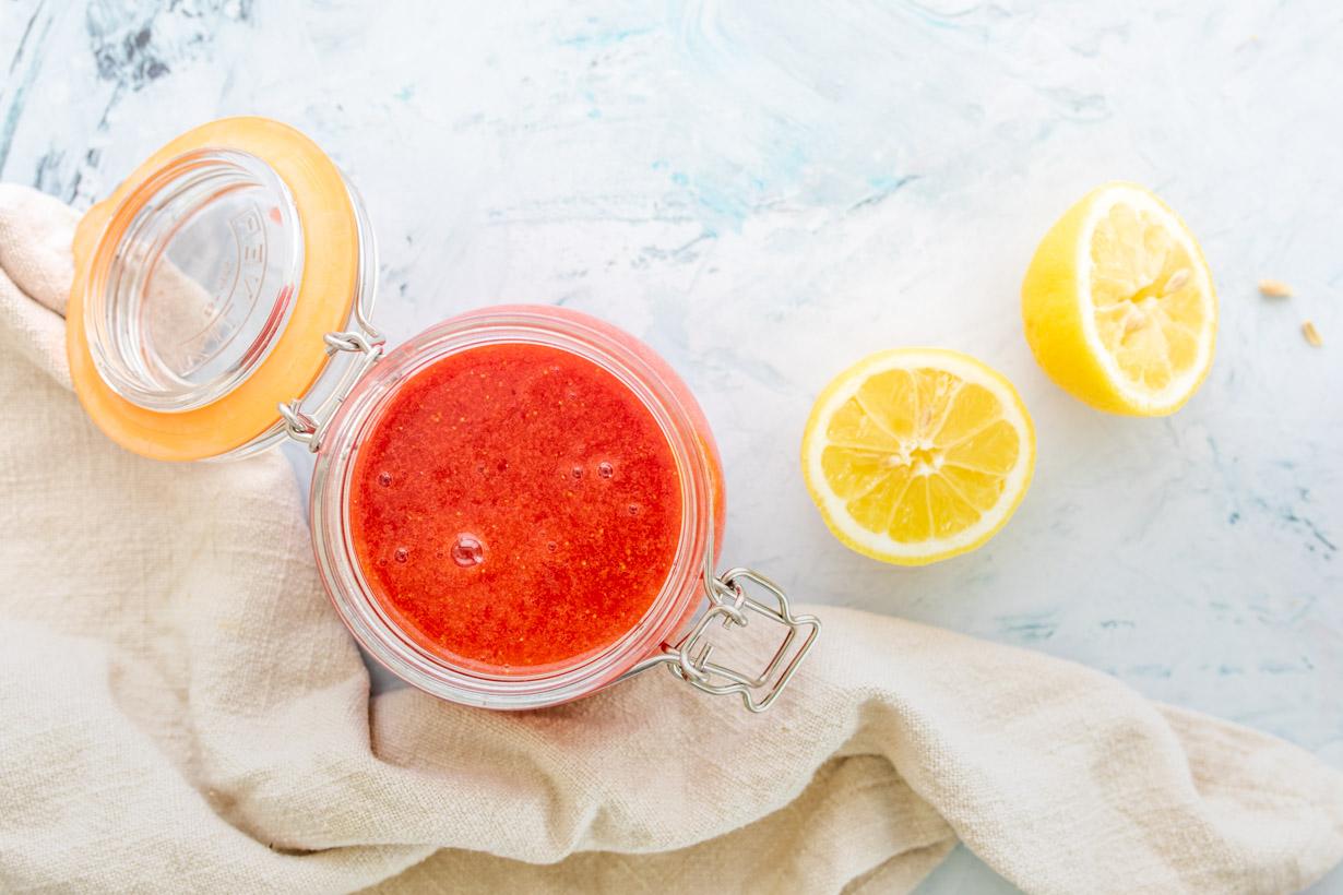 blended strawberry sauce in a jar