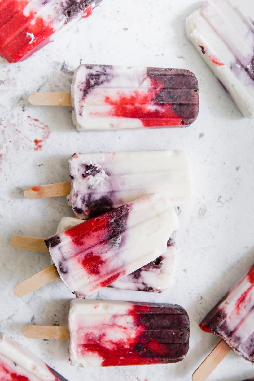9 red white and blue popsicles on a table