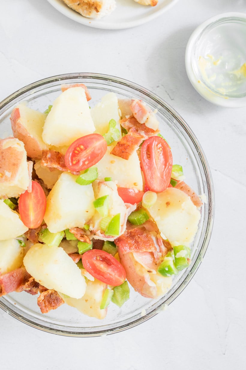 close up photo of potato salad with bacon in bowl