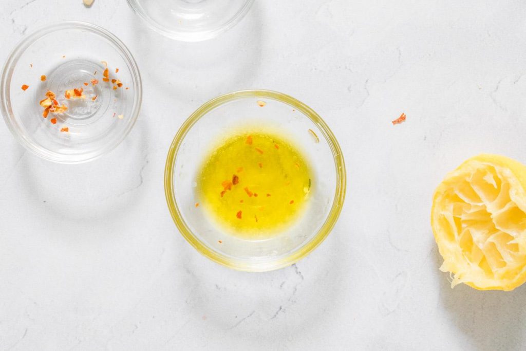 dressing in a bowl for zucchini salad with feta