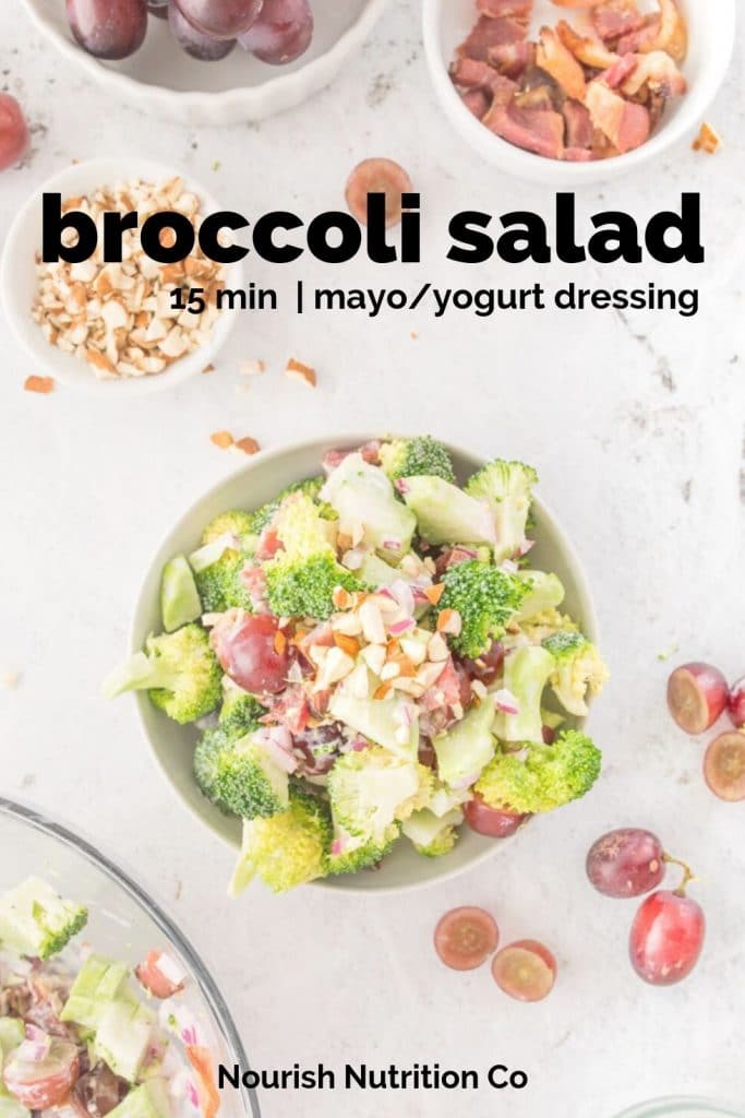 broccoli salad with grapes on a table with ingredients on table with text overlay