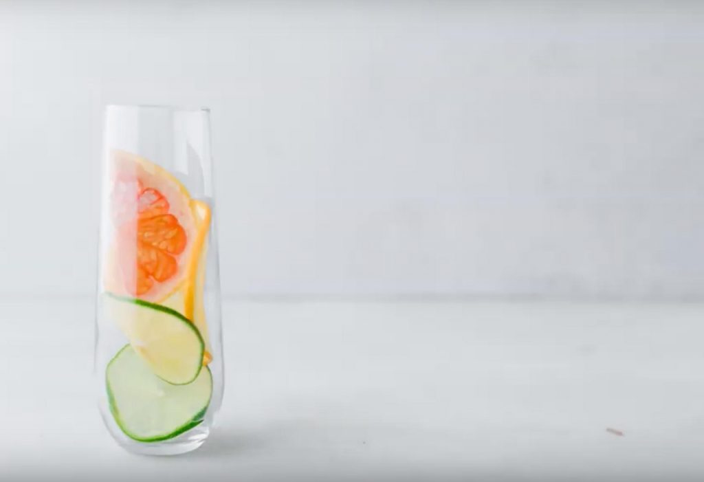 sliced citrus in a champagne glass