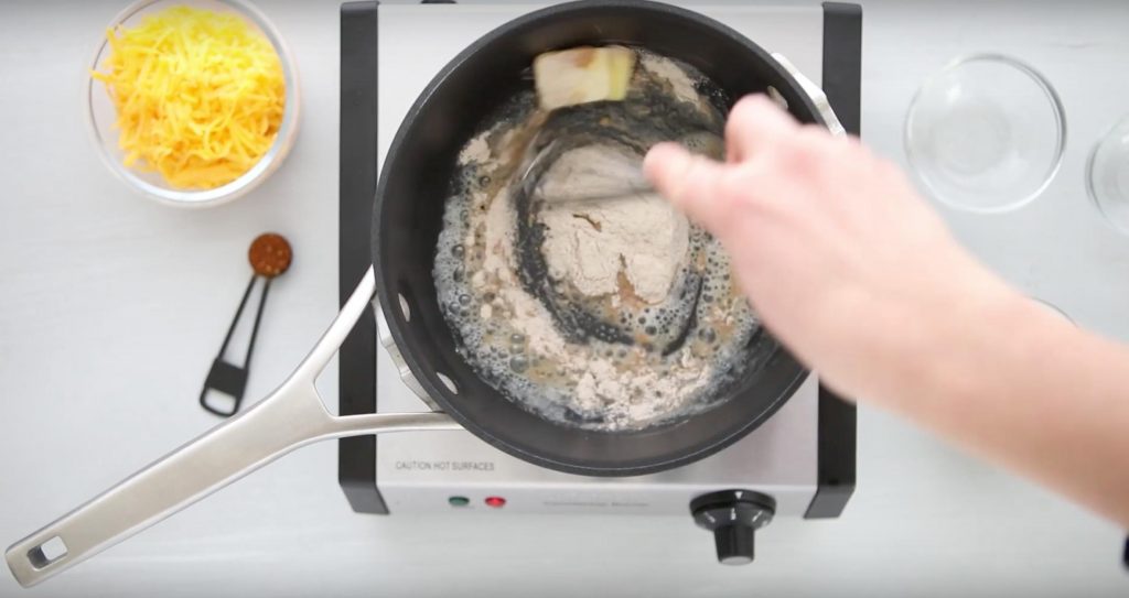 stirring butter and flour in a pot