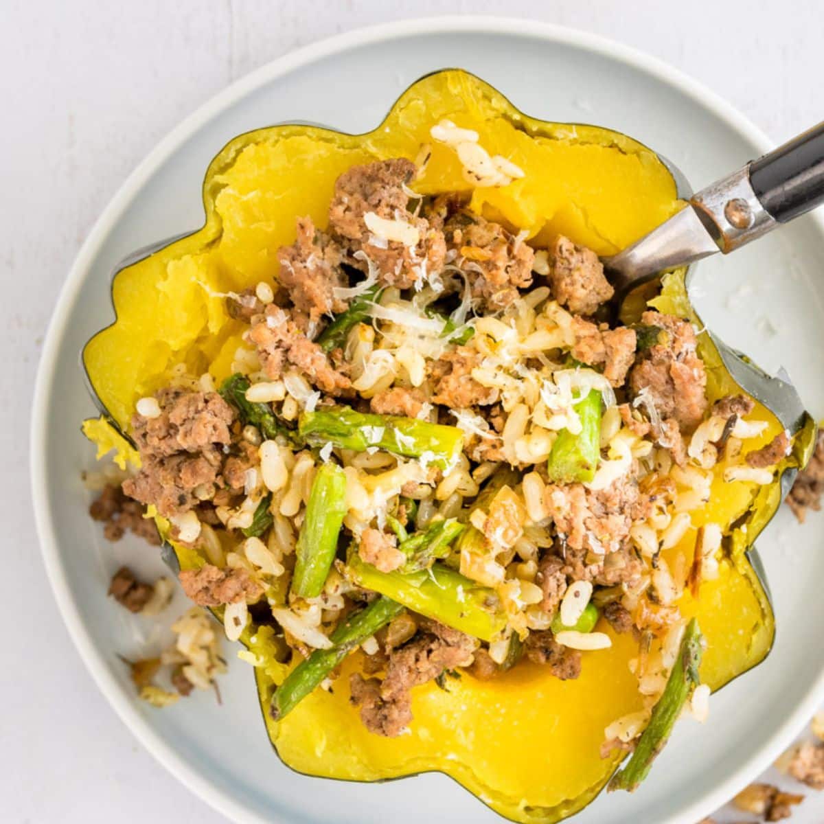 acorn squash stuffed with ground beef, rice, asparagus