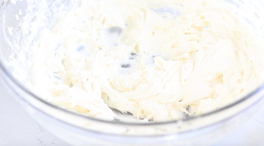 whipped cream cheese in a glass bowl