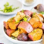 Roasted beets, potatoes, and carrots on plate
