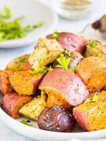 Roasted beets, potatoes, and carrots on plate