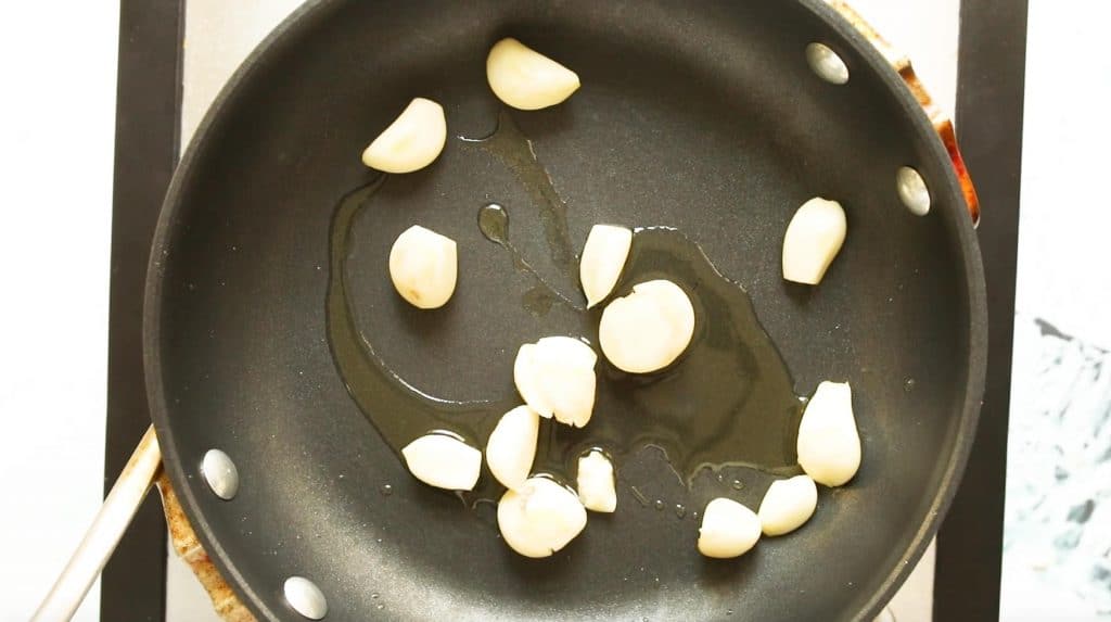 garlic cloves and olive oil in a sautee pan