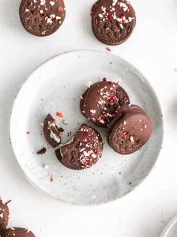 3 chocolate peppermint covered oreos on plate