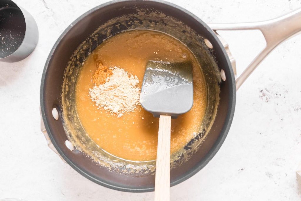 peanut butter powder in caramel sauce in a pan