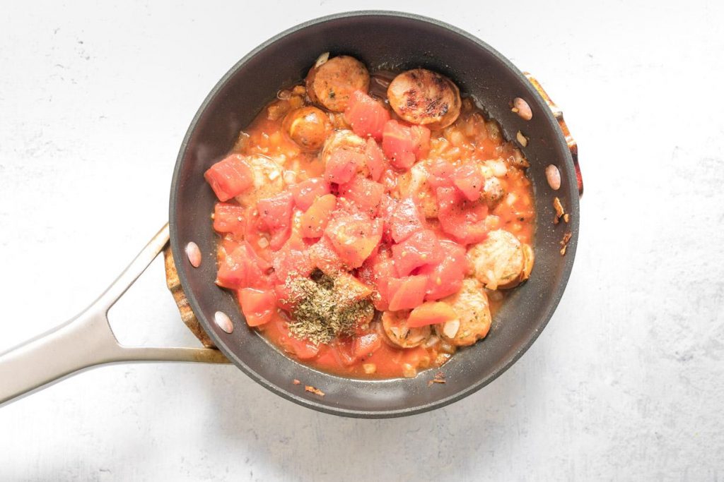 diced tomatoes, Italian seasoning, and sausage in a small frypan