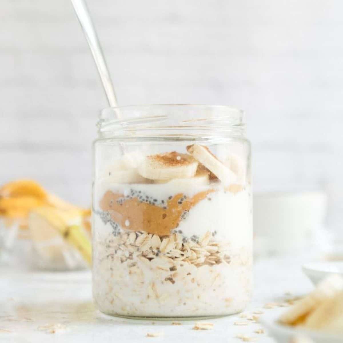jar of oats with peanut butter, yogurt, banana