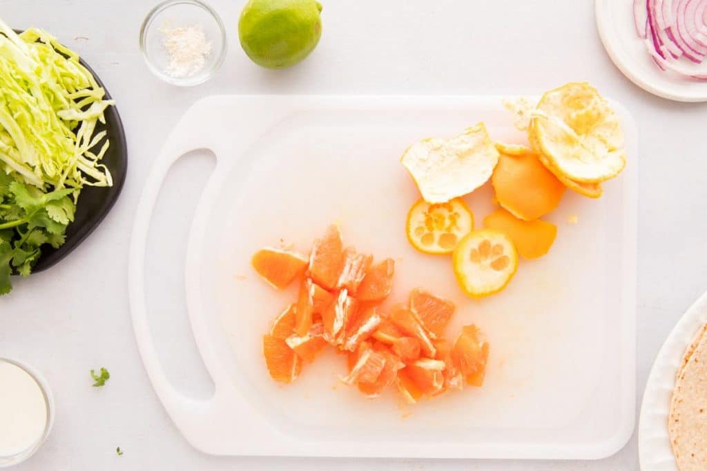 sliced Cara Cara oranges on a cutting board