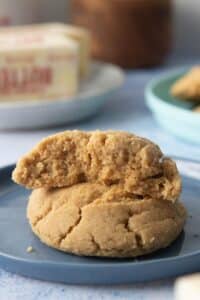 one peanut butter cookie next to mixing beaters