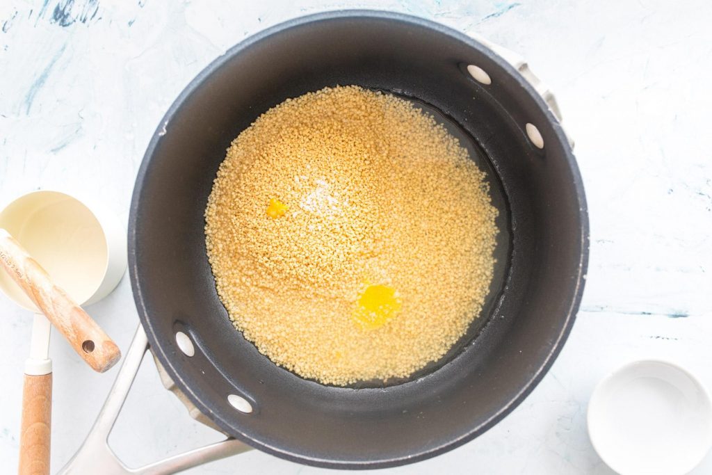 couscous and water in a black pot