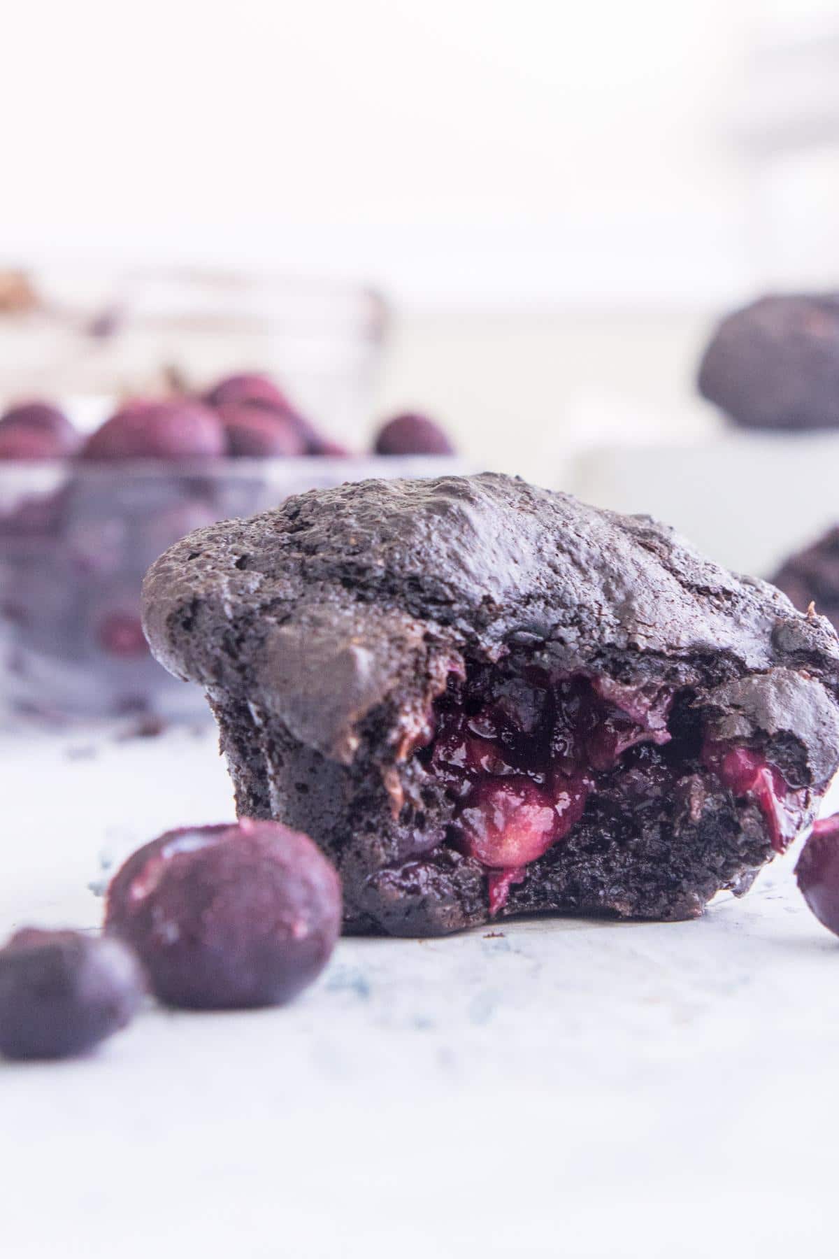 chocolate blueberry muffin with a bite taken out of it