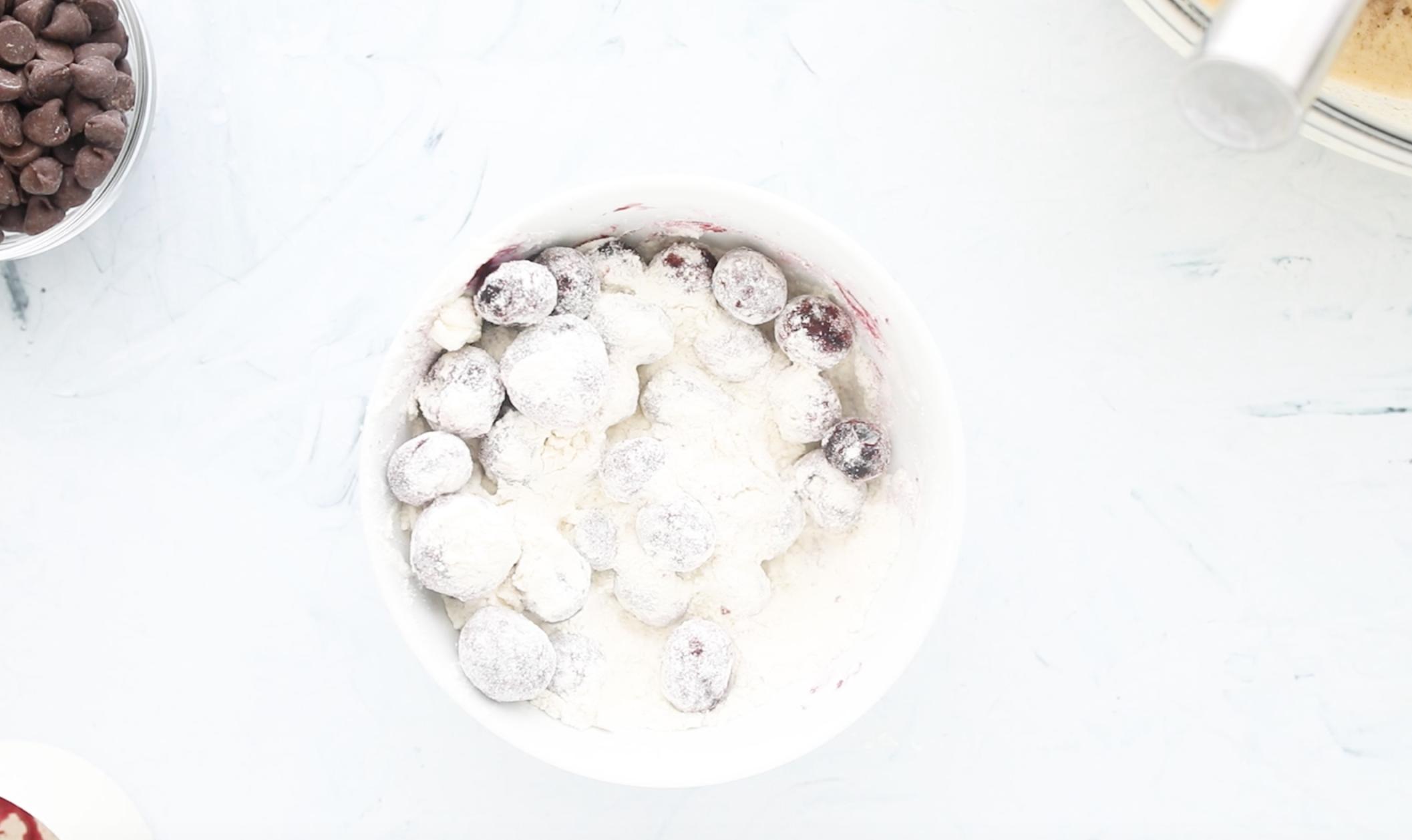 blueberries and flour in a small bowl