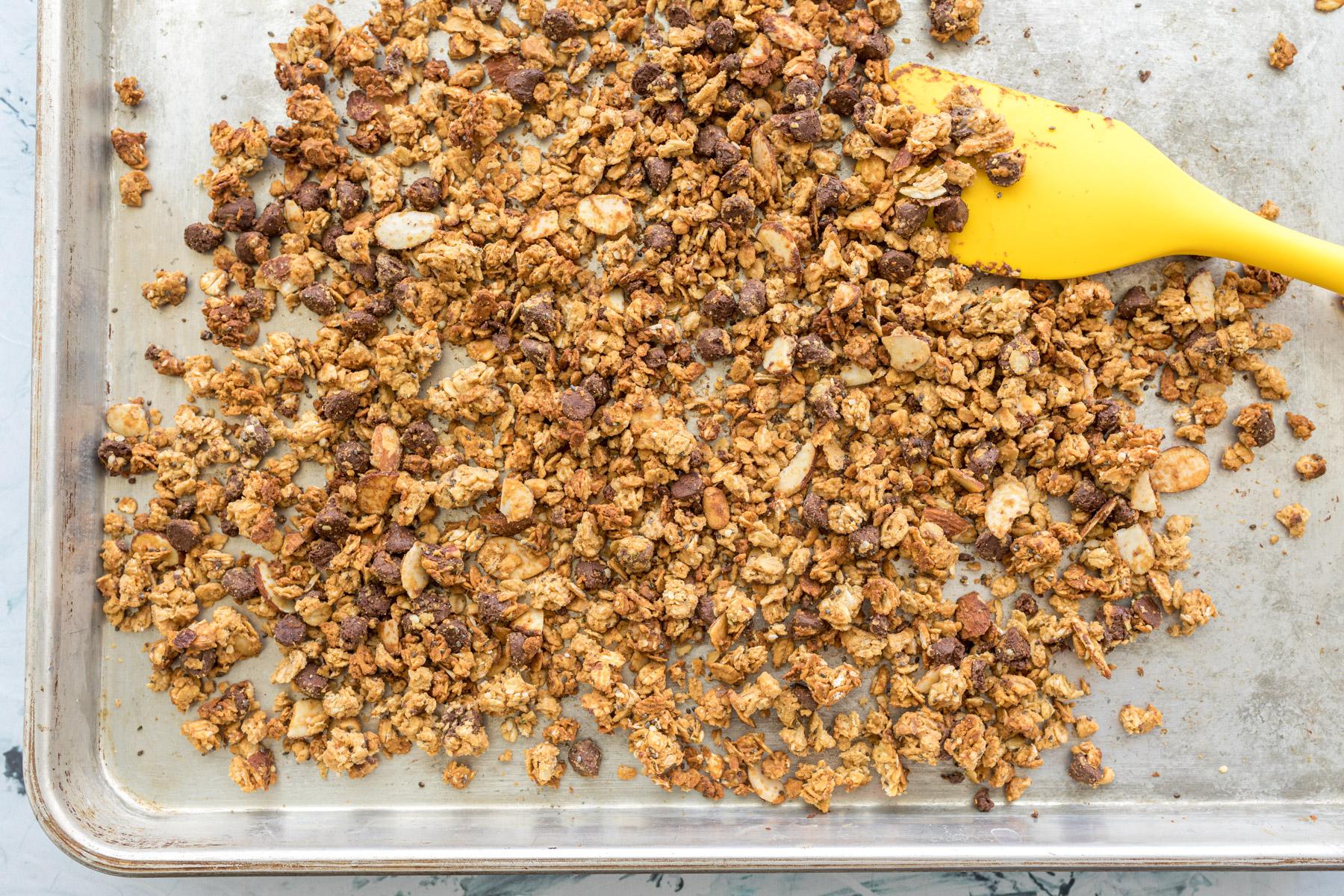 baked granola on a baking sheet