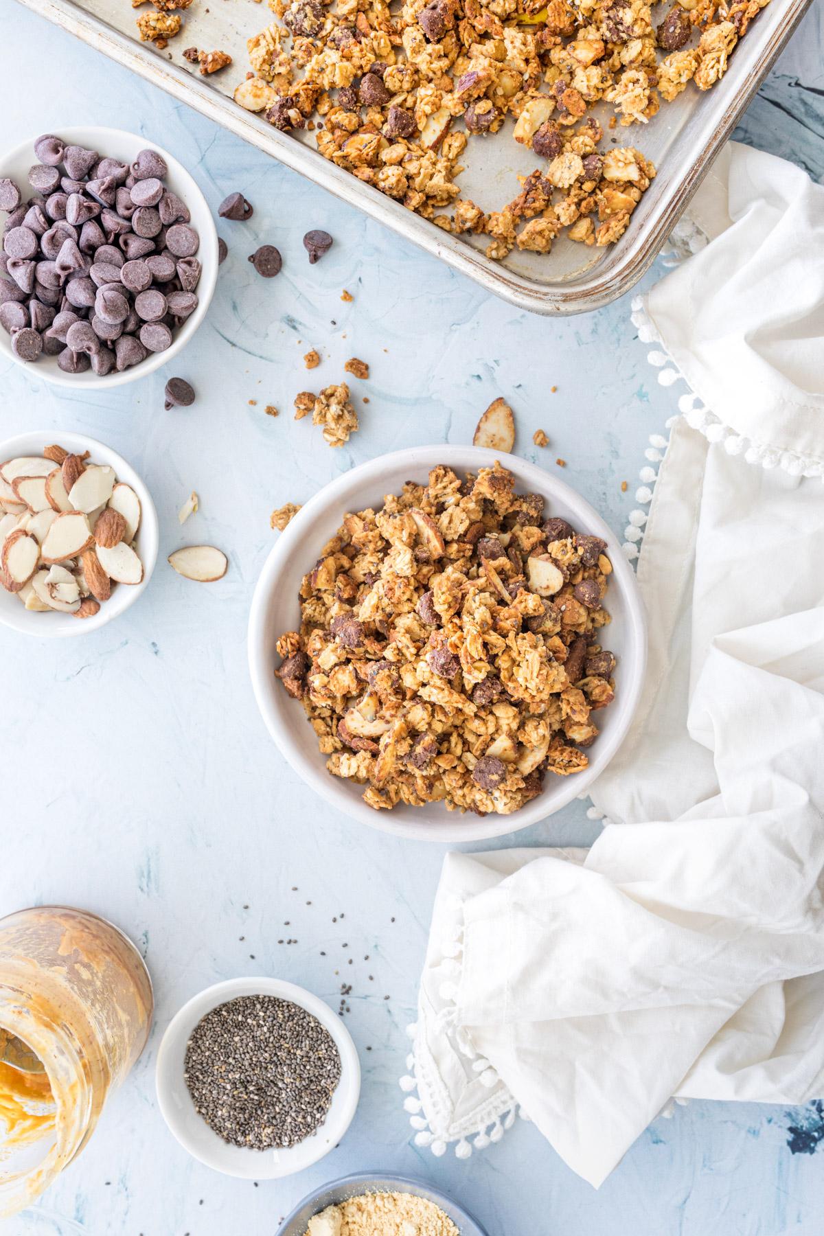 chocolate and peanut butter granola and ingredients on a table
