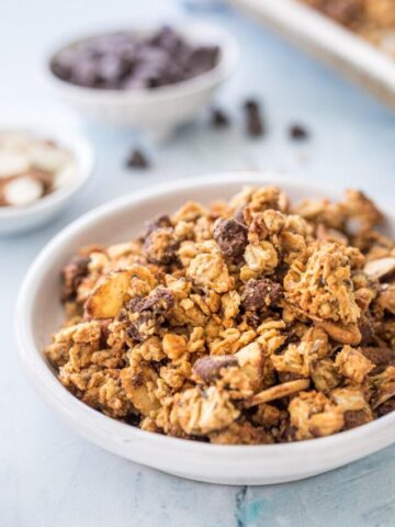 close up of protein granola with ingredients in background