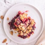 cherry oatmeal bar on a cream plate